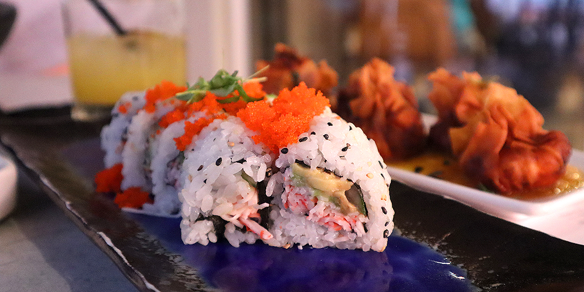 a sushi roll and rangoon